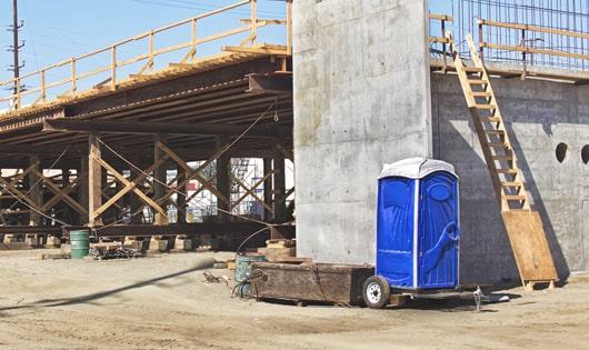 easily accessible portable toilets at a construction site, saving workers from long walks to a permanent restroom